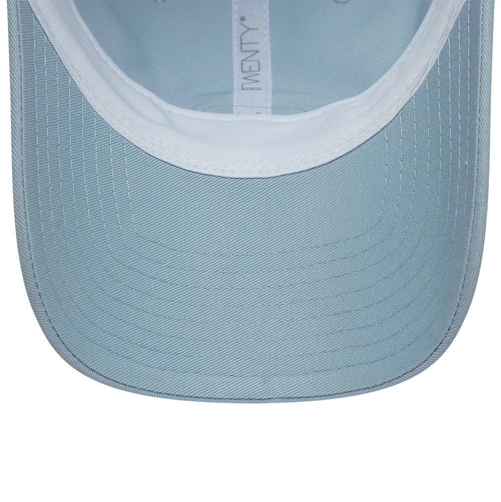 Lacoste X New Era Pastel Blue New Era 9TWENTY Adjustable Cap, inside view showing the light blue undervisor with stitching, white sweatband, and branded taping along the interior for added style and comfort.