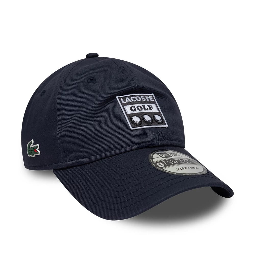 Pictured is this Lacoste X New Era 9TWENTY cap in dark blue. 1