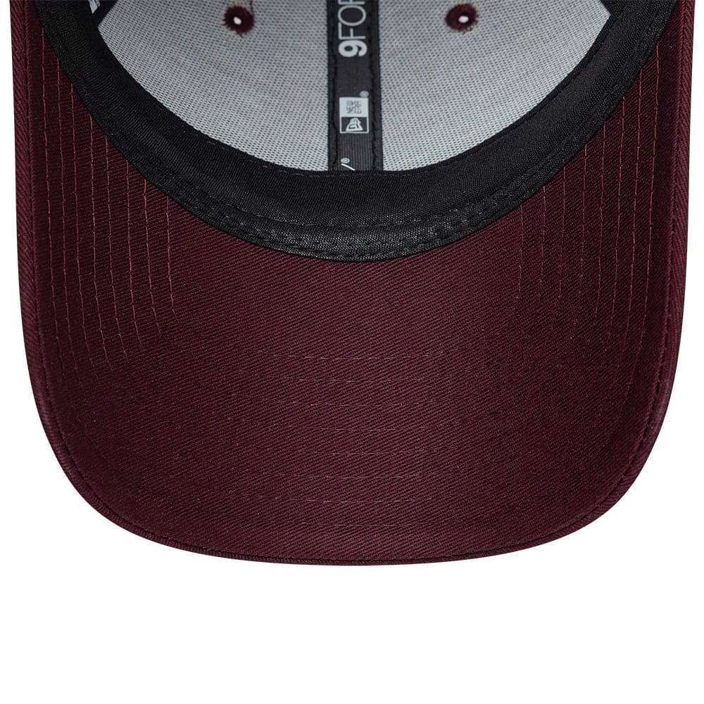 Pictured is this Womens Lacoste X New Era 9FORTY cap in dark purple. 7