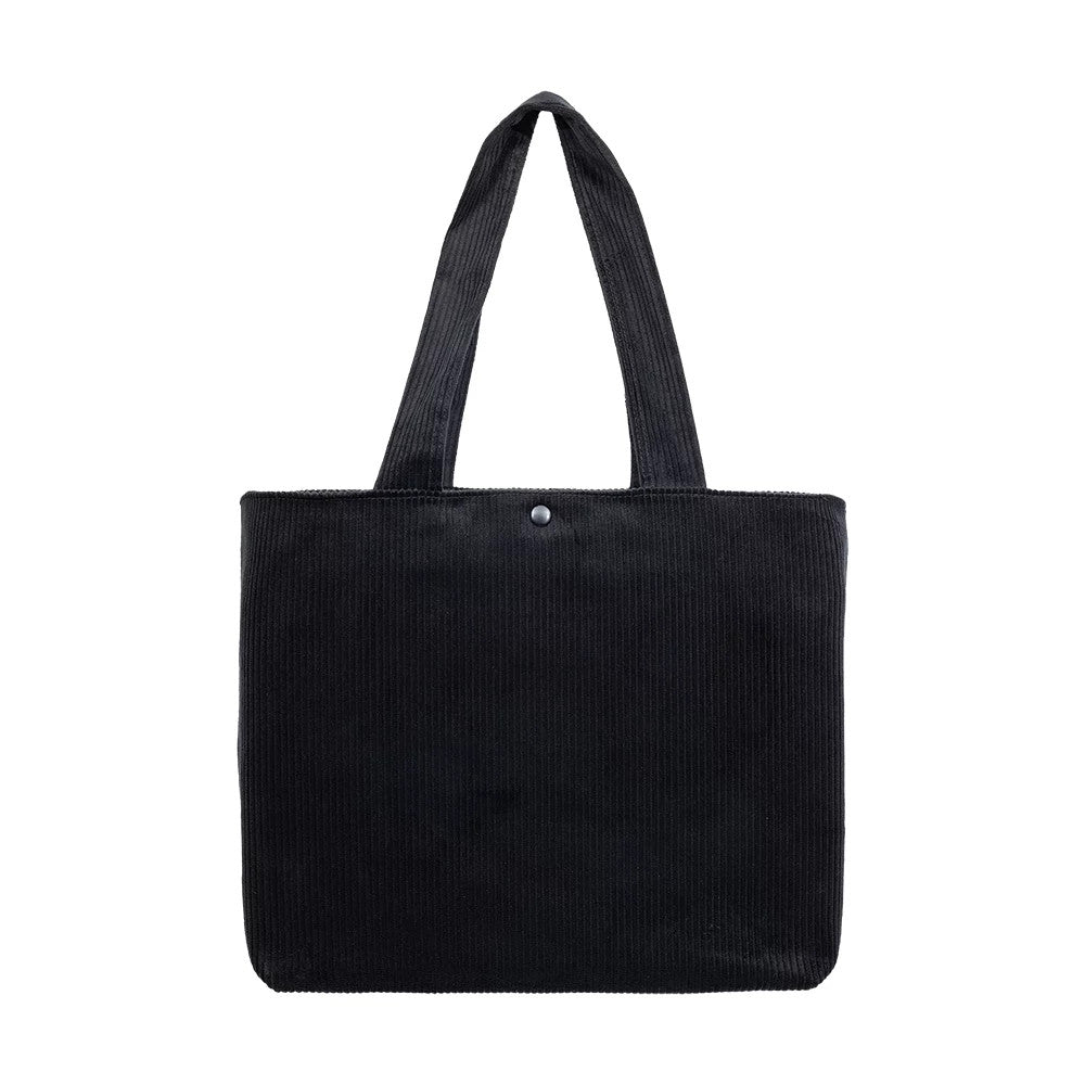 New Era New York Yankees MLB Chunky Cord Black Tote Bag, front view displaying the textured black corduroy body, two long matching handles extending from the top edge, and a single snap button closure at the centre of the upper section.