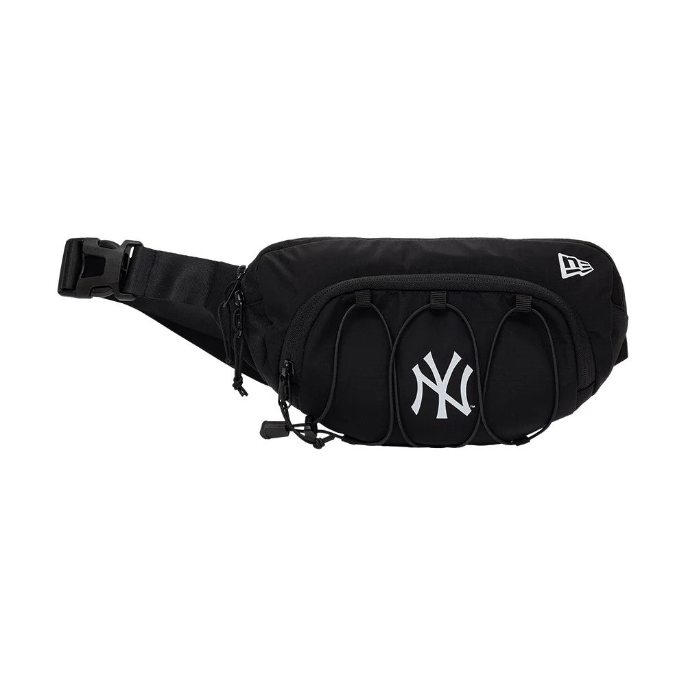 New Era New York Yankees MLB Ripstop Sport Black Waist Bag, side view displaying a white embroidered New Era logo on the right, a prominent white printed NY Yankees logo on the front pocket, and adjustable strap with buckle closure on the left.