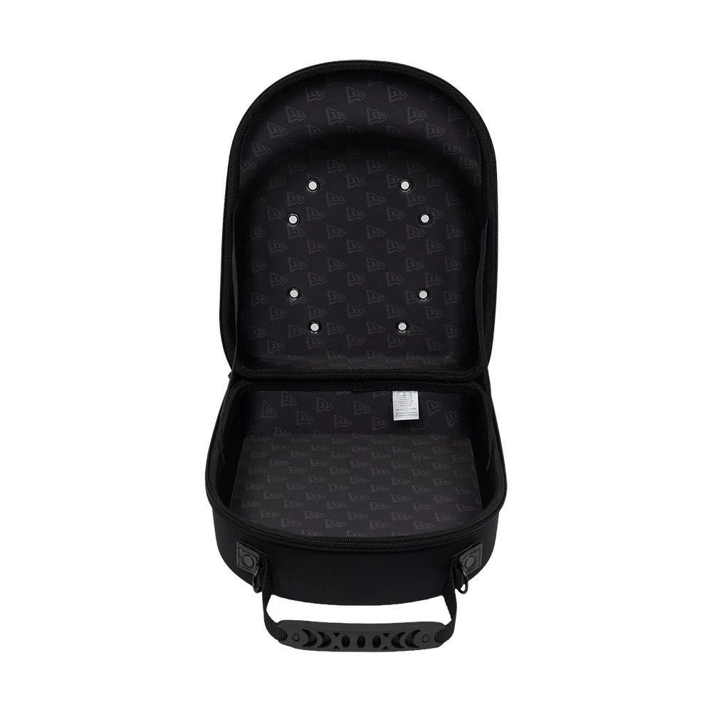 New Era Rhinestone Black 6Pk 59FIFTY Cap Carrier, open view showing the interior lined with a repeating New Era logo pattern, two eyelets on the inside of the lid, and a handle attached at the base.