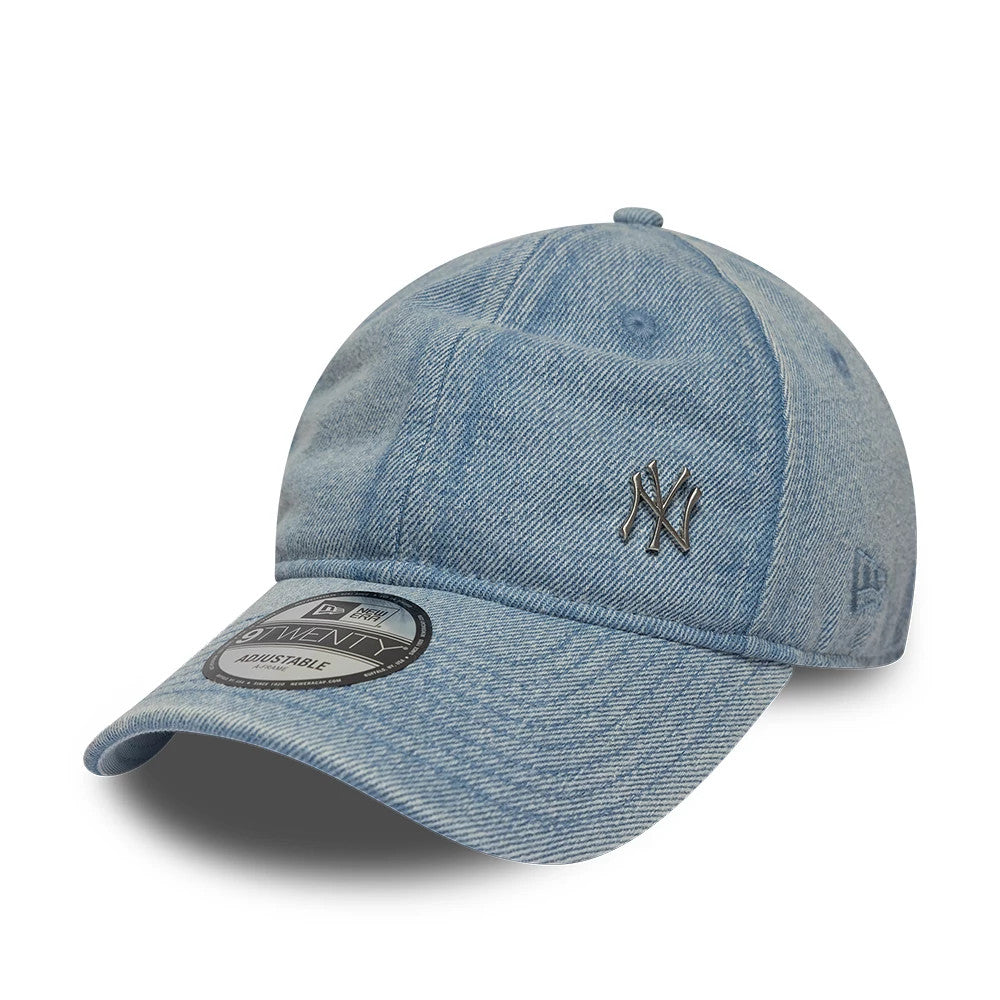 New York Yankees MLB Washed Denim Pastel Blue New Era 9TWENTY Adjustable Cap, three-quarter view showing the grey NY logo in raised embroidery on the front panel, with a black and white 9TWENTY size sticker on the curved visor.