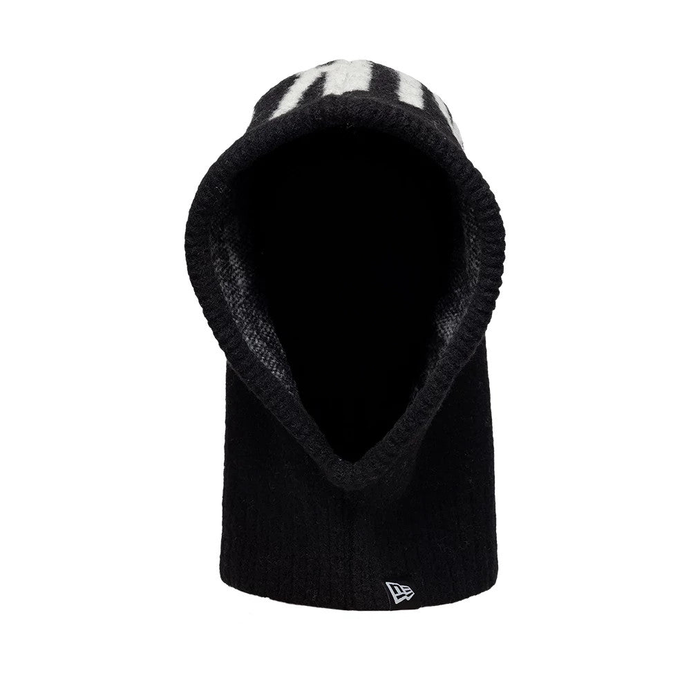 New Era New York Yankees MLB Script Black Balaclava Hat, front view showing the black knitted fabric with a prominent white embroidered script design on top, and the New Era flag logo positioned at the lower edge on the side.
