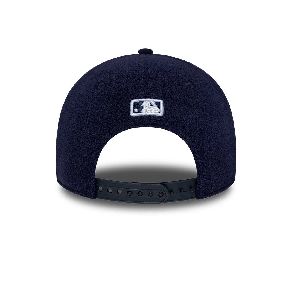 New York Yankees MLB Fleece Navy New Era 9FORTY M-Crown Adjustable Cap, rear view showing the white embroidered MLB Batterman logo at the centre back, with a navy fleece texture and a black adjustable snap closure at the back.