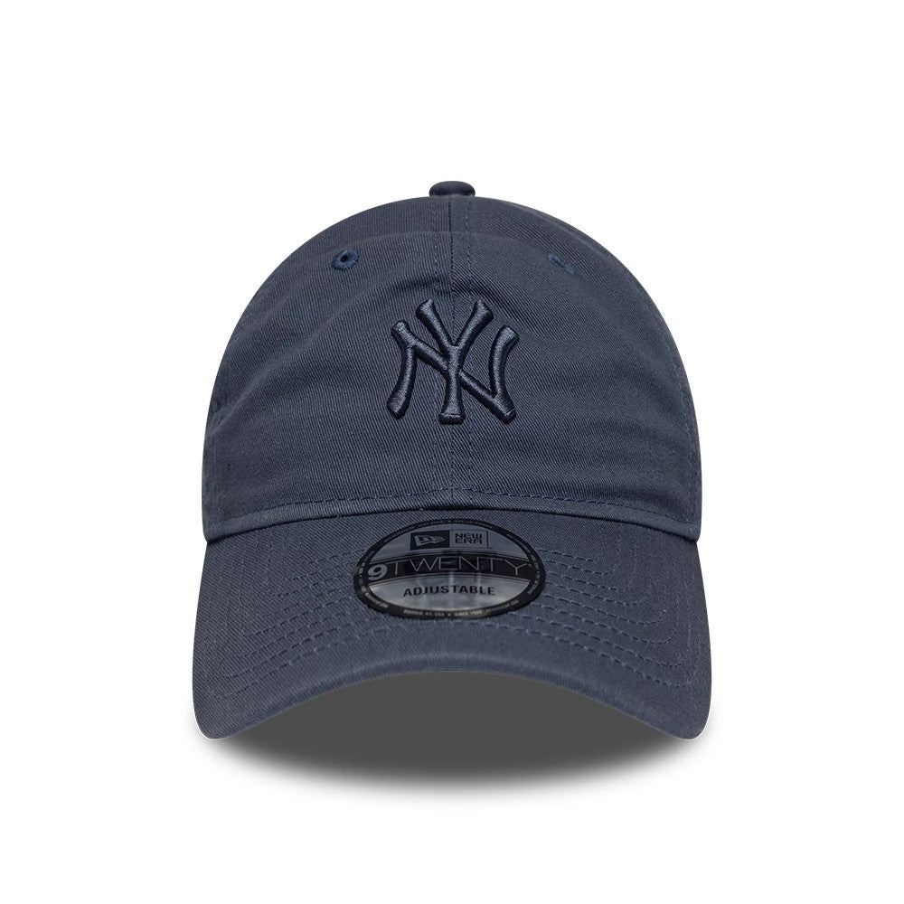 New York Yankees MLB Washed Midi Logo Dark Blue New Era 9TWENTY Adjustable Cap, front view showing the raised dark blue NY logo embroidered on the centre front panel, with a pre-curved visor and 9TWENTY size sticker on the visor.