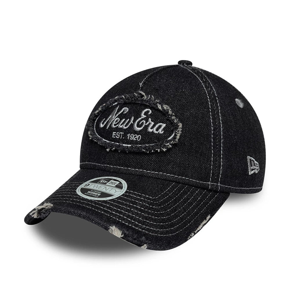 Womens New Era Distress Black 9TWENTY A-Frame Adjustable Cap, three-quarter view showing the distressed black fabric with New Era Est. 1920 patch on the front panel, curved visor with 9TWENTY size sticker, and New Era flag logo on the left side.