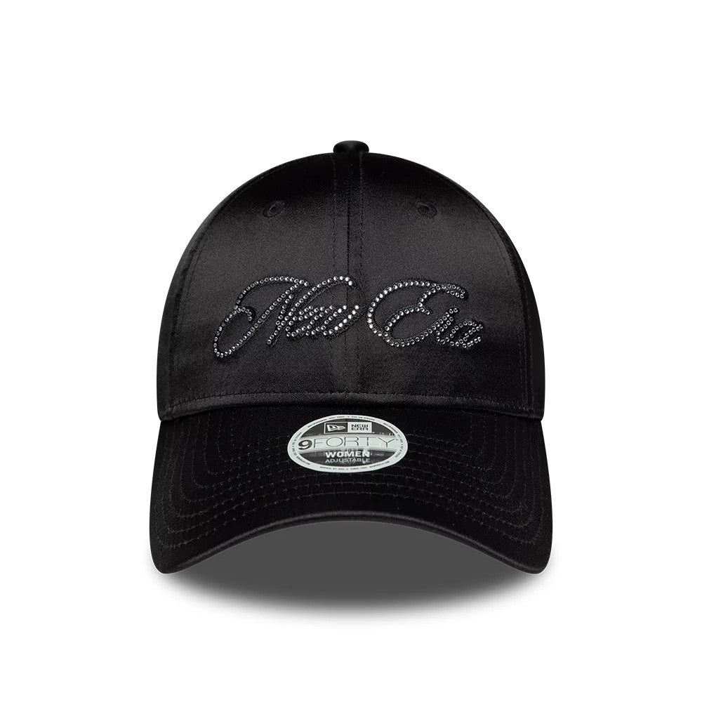Womens New Era Satin Gem Black 9FORTY Adjustable Cap, front view showing a glossy black satin crown with the New Era script logo embellished with small gems on the front panel and a 9FORTY size sticker on the curved black visor.