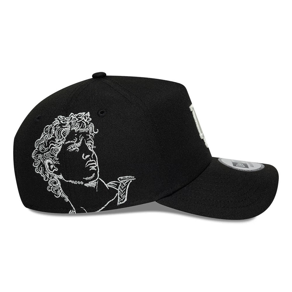 LA Dodgers MLB Mythical Black New Era 9FORTY E-Frame Adjustable Cap, side view showcasing an intricate white embroidered sculpture design on the crown, a curved black visor, and a 9FORTY size sticker on top.