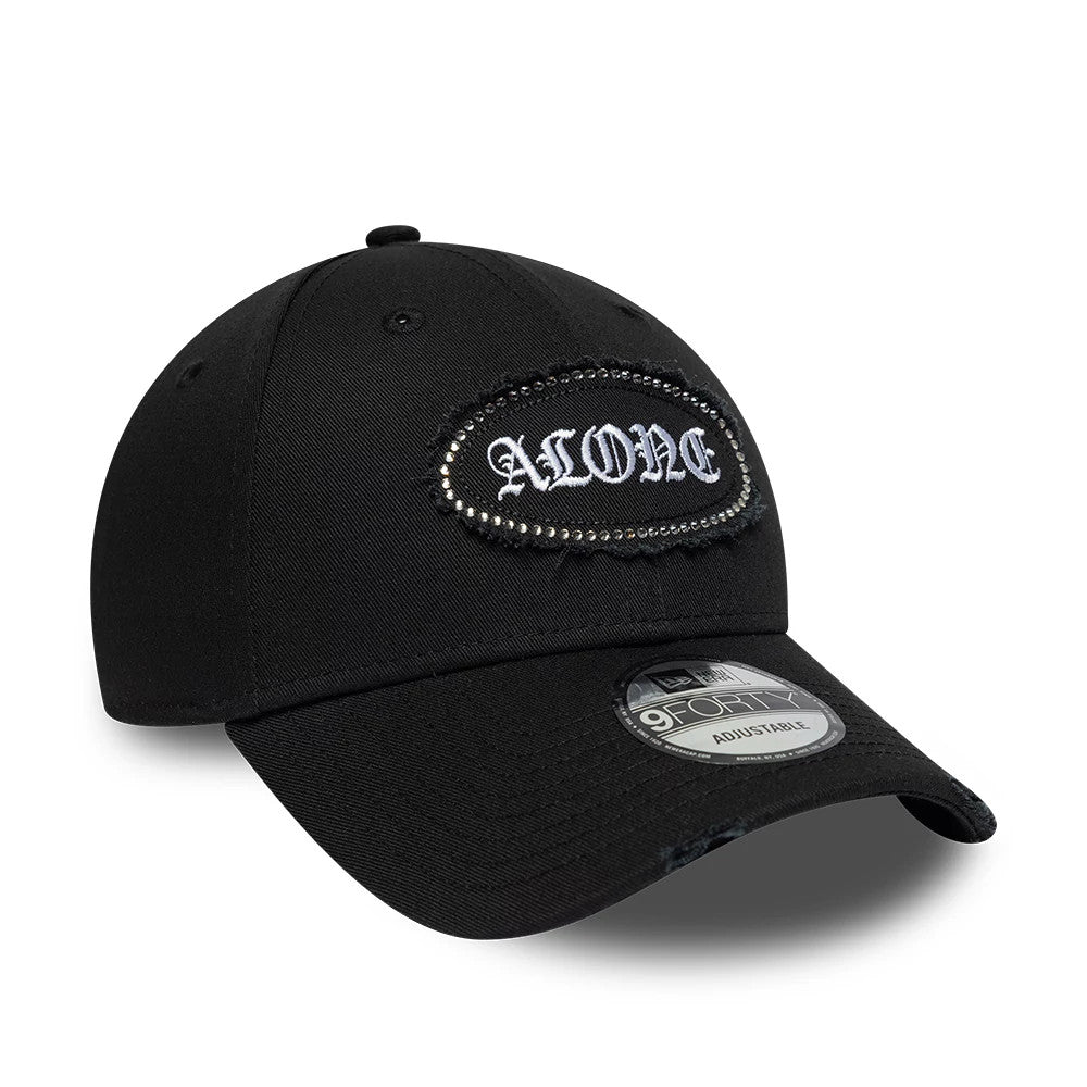 New Era Gem Patch Distress Black 9FORTY Adjustable Cap, three-quarter view showing the embroidered 'ALONE' patch with gem on the front panel, a pre-curved black visor with a 9FORTY size sticker, and an adjustable strap at the back.