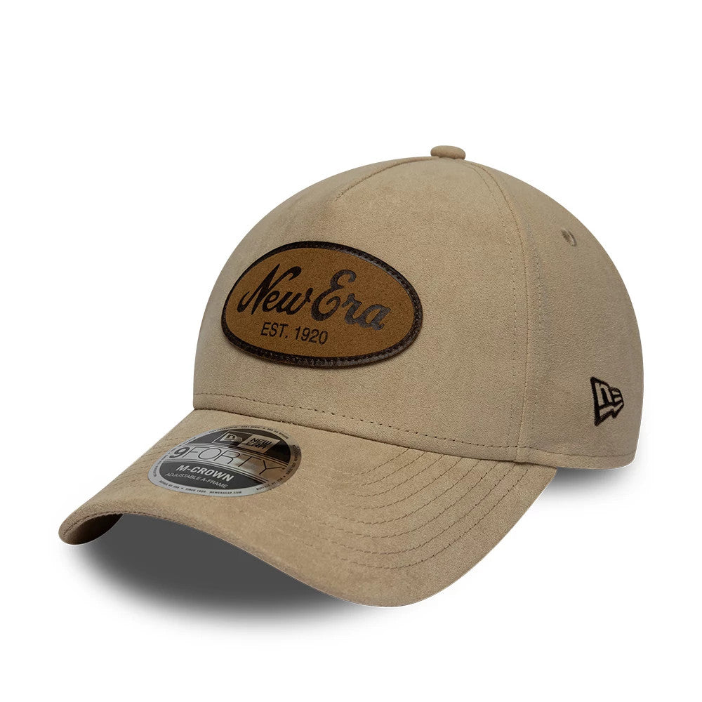 Pictured is this New Era Faux Suede 9FORTY M-Crown A-Frame cap in light beige. 1
