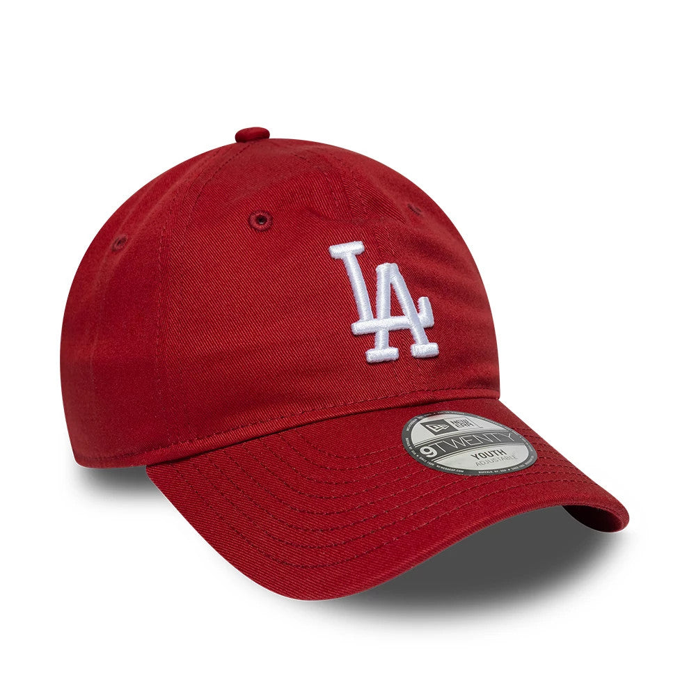 LA Dodgers Youth MLB League Essential Dark Red New Era 9TWENTY Adjustable Cap, three-quarter view showing the white embroidered LA logo centred on the unstructured dark red crown, with matching curved visor and 9TWENTY size sticker.