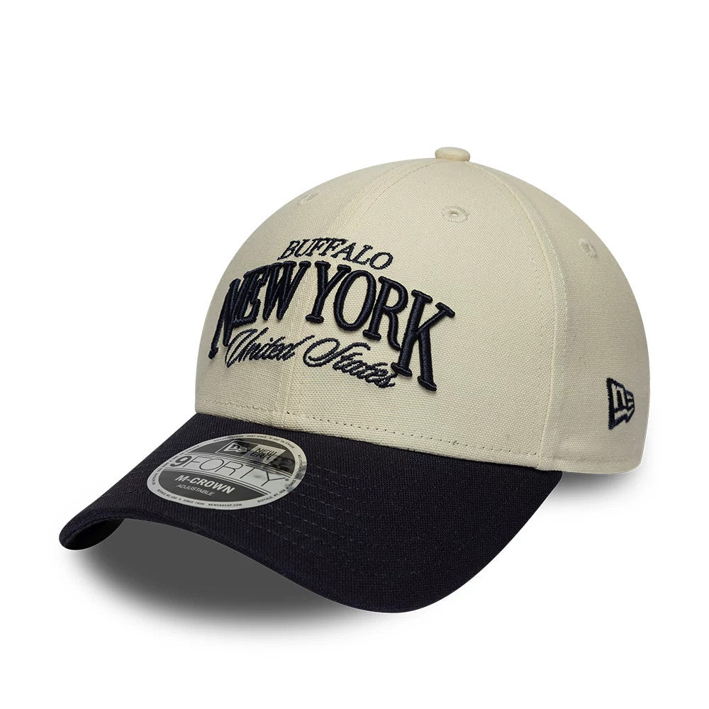New Era New York Light Beige & Black 9FORTY M-Crown Adjustable Cap, three-quarter view with black raised embroidery of Buffalo New York United States on the light beige front panels, a contrasting black curved visor, and a 9FORTY size sticker.