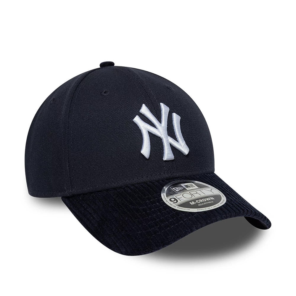 New York Yankees MLB Cord Visor Navy New Era 9FORTY M-Crown Adjustable Cap, three-quarter view showing the raised white embroidered NY logo on the front panel, a navy corduroy visor, and the 9FORTY size sticker on the visor.
