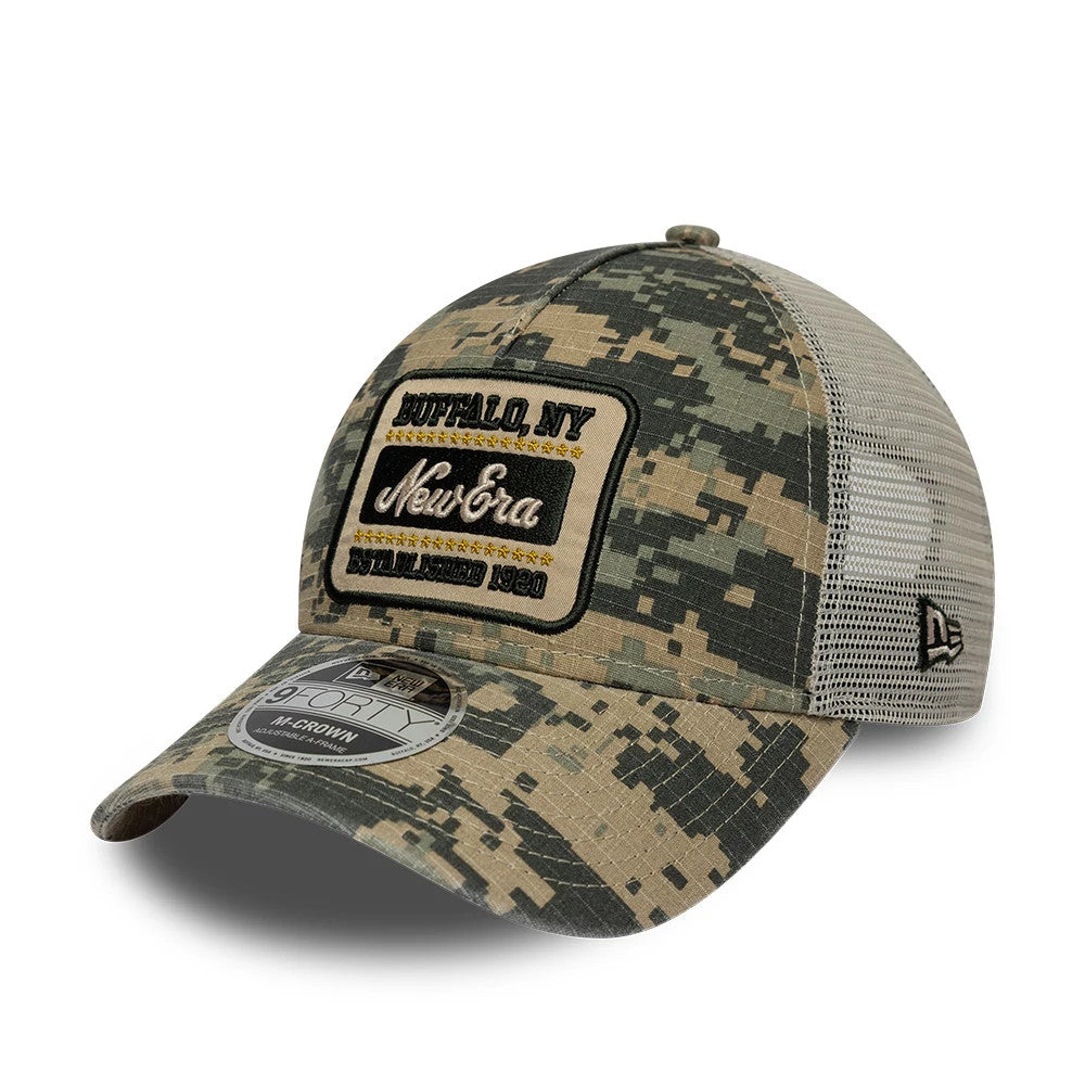New Era Camo Dark Green 9FORTY M-Crown A-Frame Trucker Adjustable Cap, three-quarter view showing a black patch with gold embroidery on the front camo panel, a 9FORTY size sticker on the curved visor.