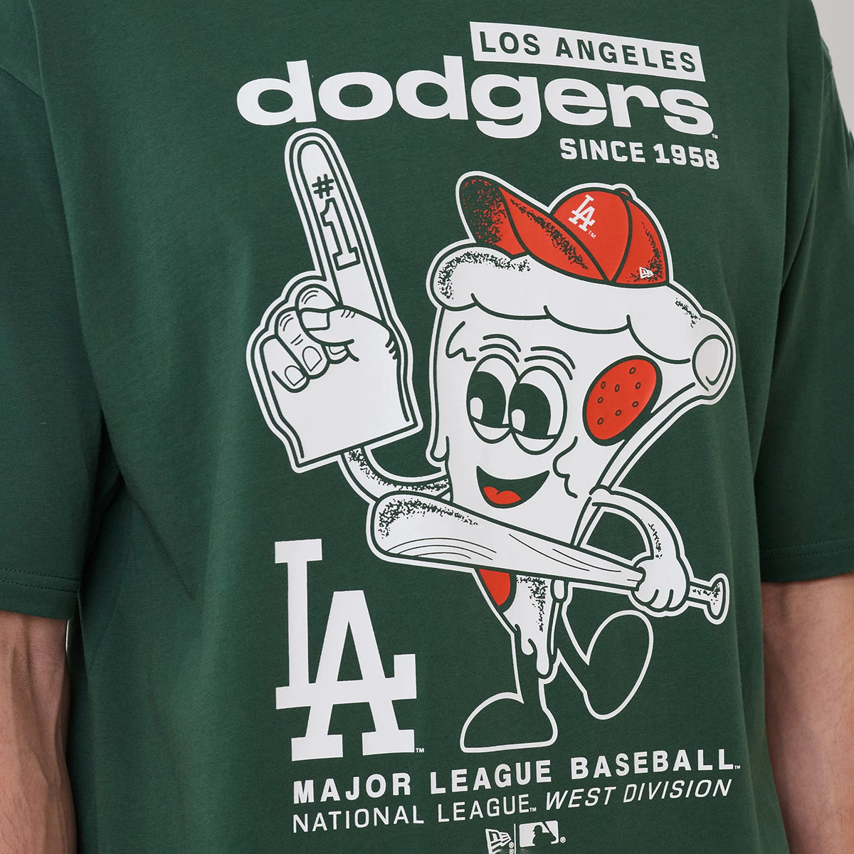 New Era LA Dodgers MLB Food Graphic Dark Green Oversized T-Shirt, front view displaying a playful pizza slice character holding a bat and wearing a red cap, with white printed Dodgers lettering and LA logo above, styled on a model's torso.