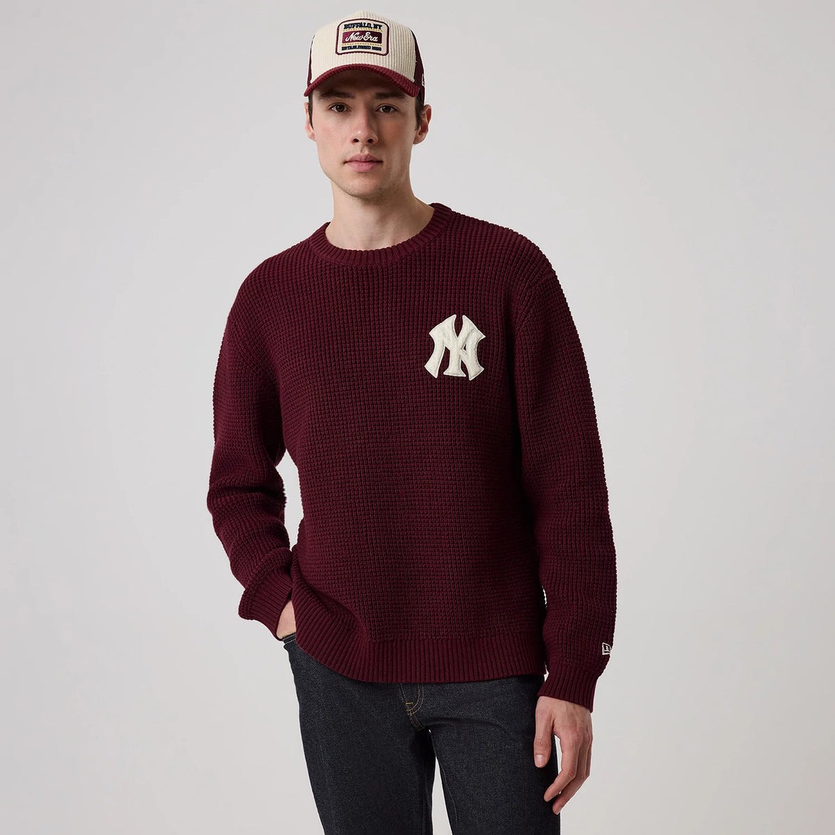 The model is wearing this MLB Waffle Knit New York Yankees Crew Neck Sweater in dark purple. 3