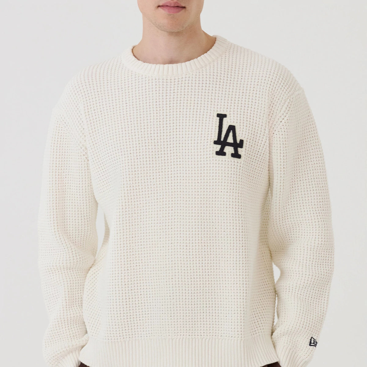 The model is wearing this MLB Waffle Knit LA Dodgers Crew Neck Sweater in open white. 3