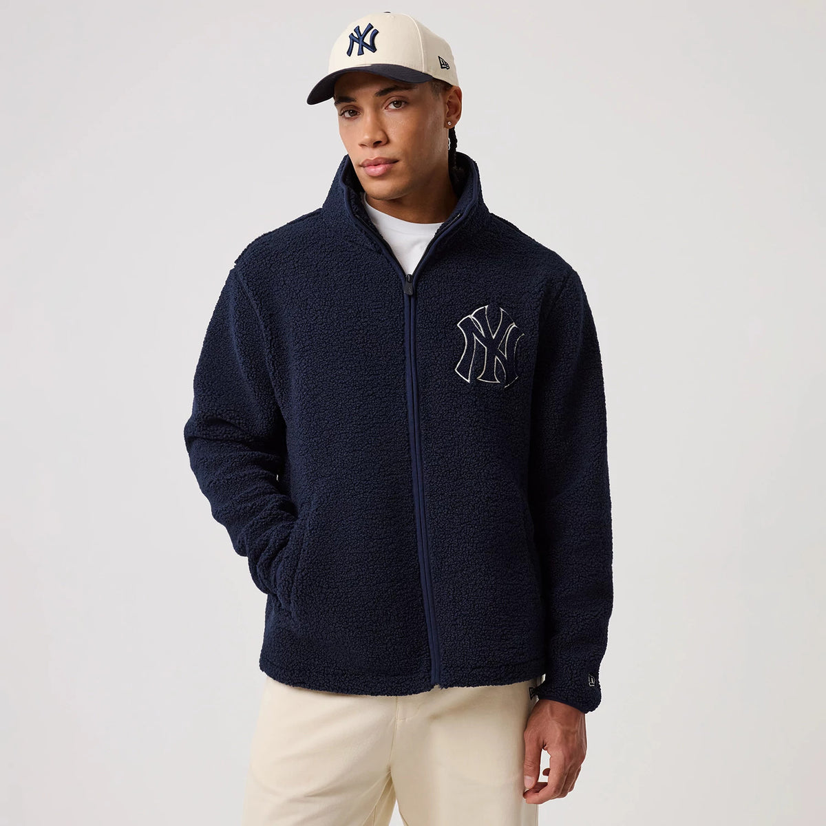The model is wearing this MLB New York Yankees Sherpa Jacket in dark blue. 3
