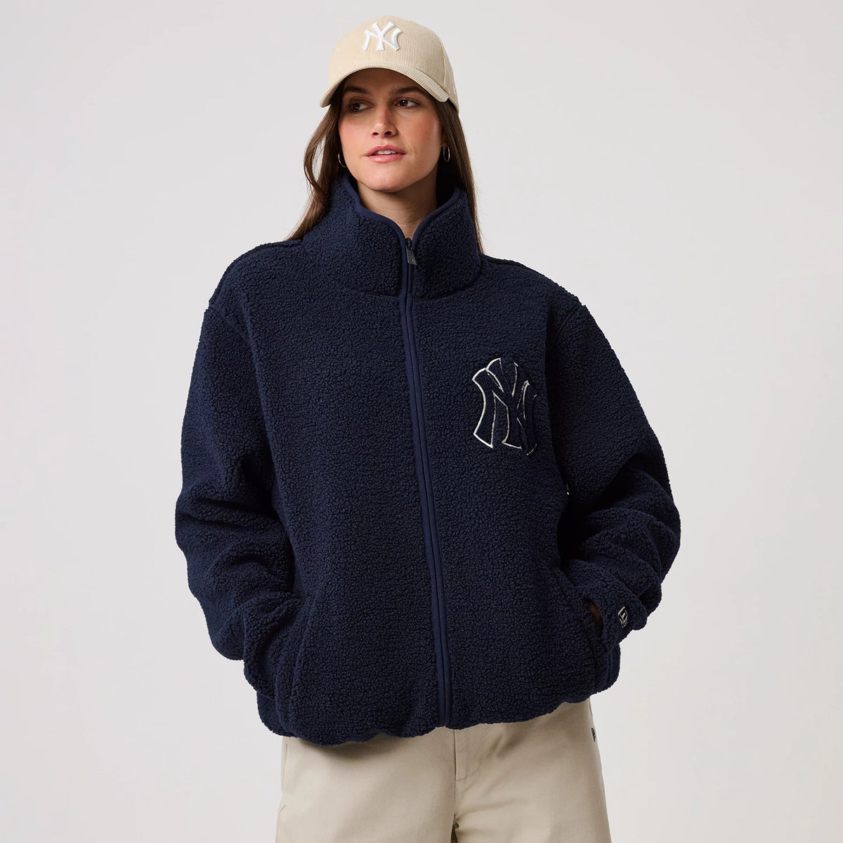 The model is wearing this MLB New York Yankees Sherpa Jacket in dark blue. 4