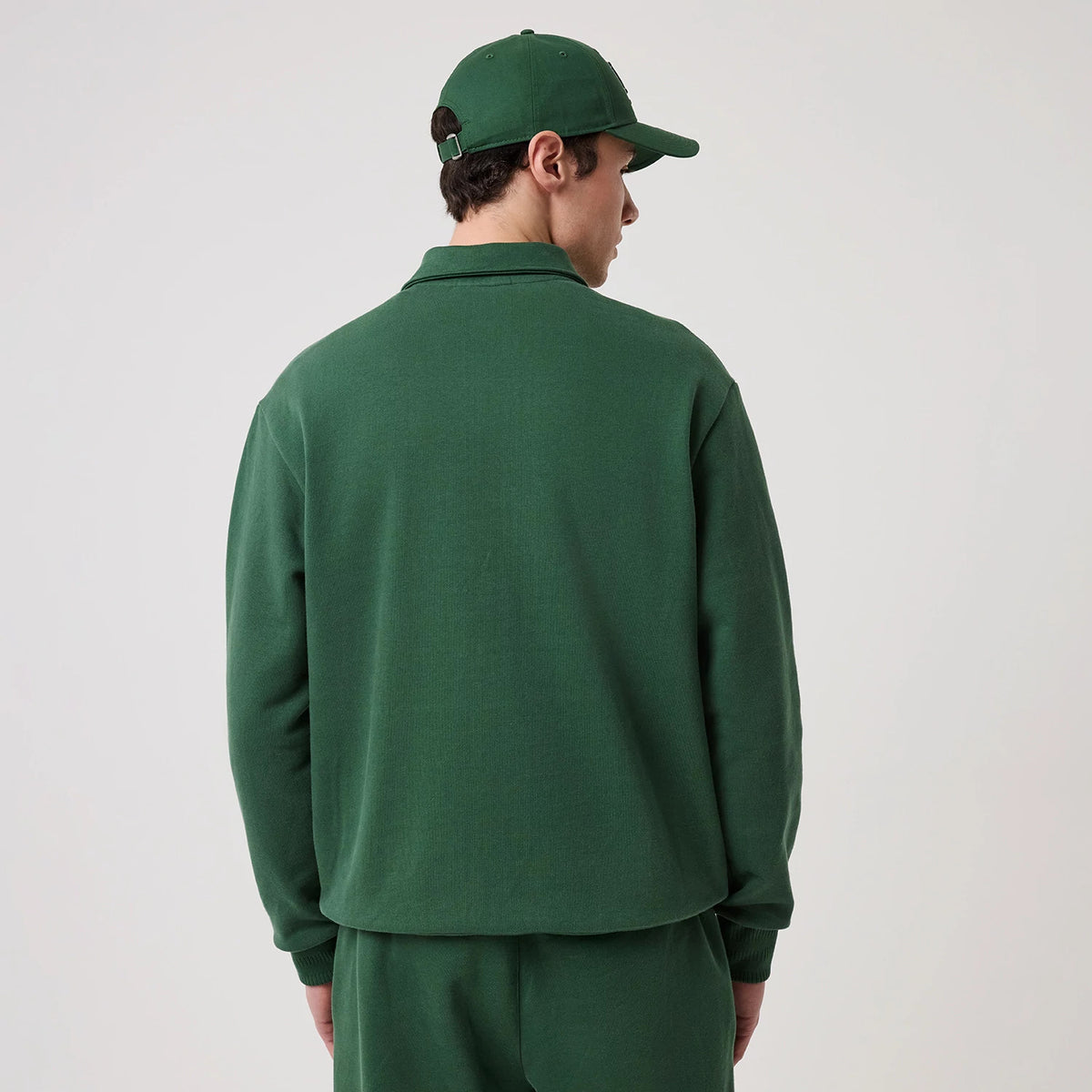 The model is wearing this MLB LA Dodgers 1/4 Zip Sweater in dark green. 2