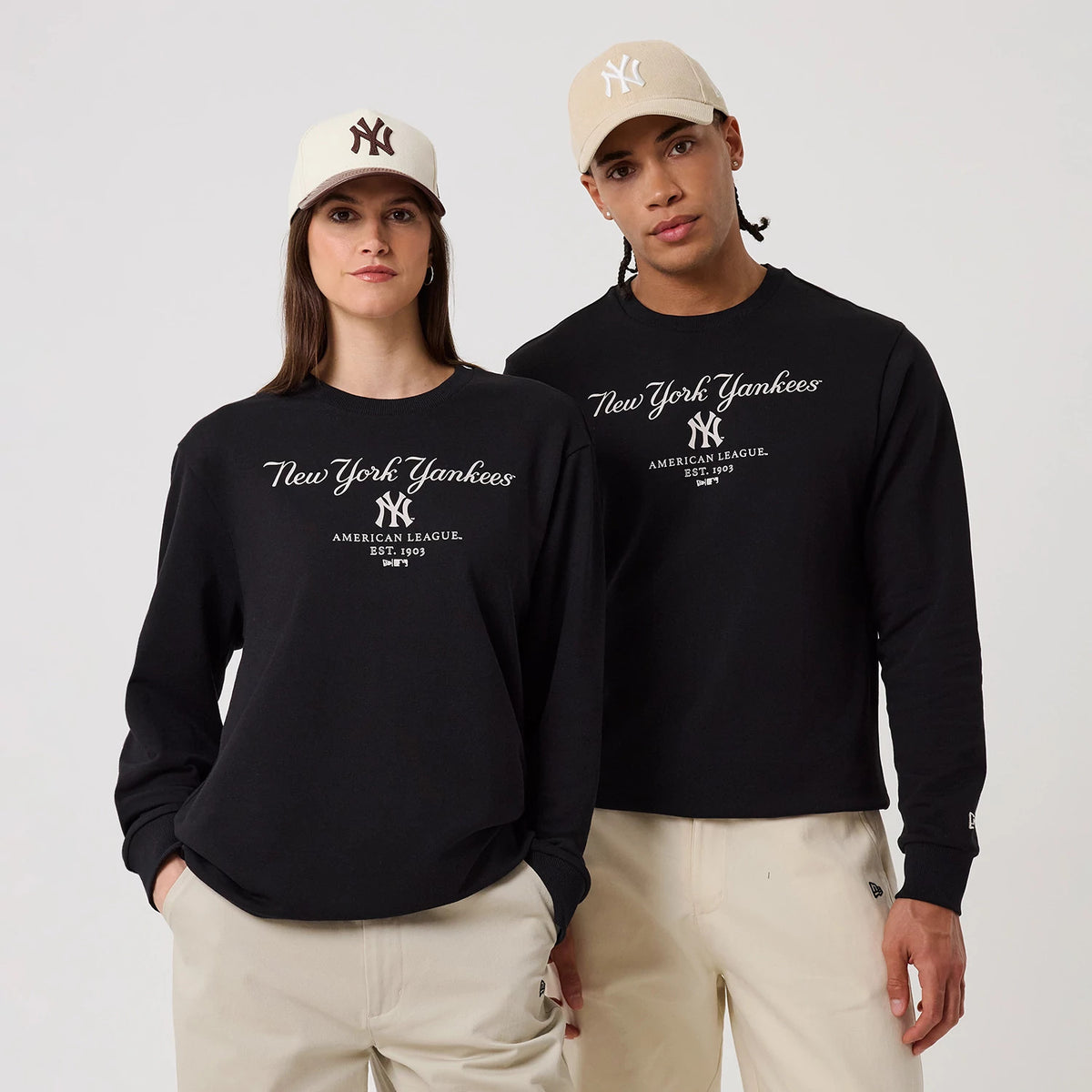 The model is wearing this MLB Linear New York Yankees Crew Neck Sweater in black. 1