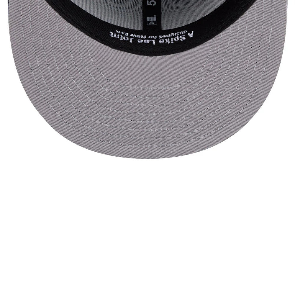 New York Yankees MLB X Spike Lee Script Navy New Era 59FIFTY Fitted Cap, inside view showing grey undervisor with white stitching detail, black sweatband featuring A Spike Lee Joint branding and labels, and size sticker on the headband.