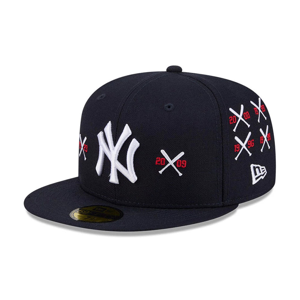 Yankees MLB X Spike Lee Crossed Bats Navy New Era 59FIFTY Fitted Cap, three-quarter view showing raised white NY logo on the front panel, red and white crossed bats graphics with years on the side, and a gold 59FIFTY size sticker on the visor.