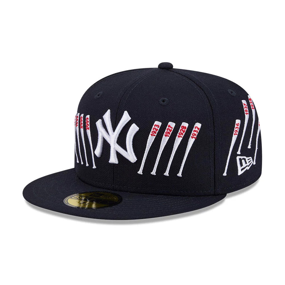 Yankees MLB X Spike Lee Baseball Bats Navy New Era 59FIFTY Fitted Cap, three-quarter view showing a raised white NY logo on the front panel, embroidered baseball bats with red years on each side, and a gold 59FIFTY size sticker on the flat visor.