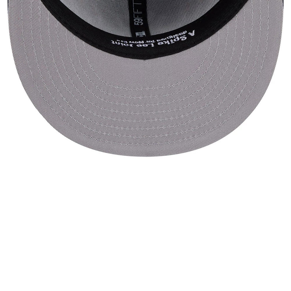 Yankees MLB X Spike Lee Baseball Bats Navy New Era 59FIFTY Fitted Cap, inside view showing black taped seams with white Spike Lee text, a grey undervisor, and a black sweatband featuring a partially 59FIFTY logo.
