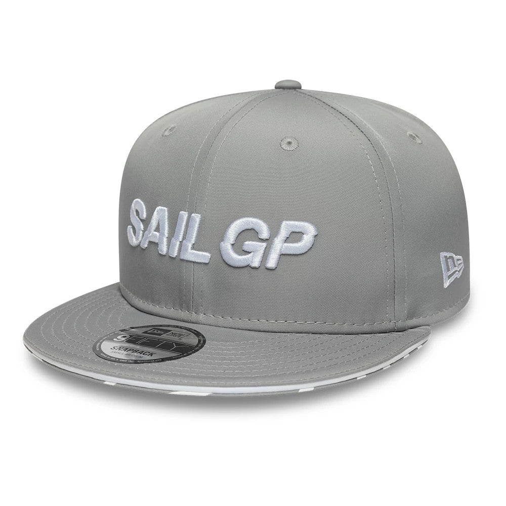 Sail GP Limited Grey New Era 9FIFTY Snapback Adjustable Cap, front view showing raised white embroidered Sail GP lettering on the front panels, a grey visor with a black 9FIFTY size sticker, and the New Era flag logo on the left side.