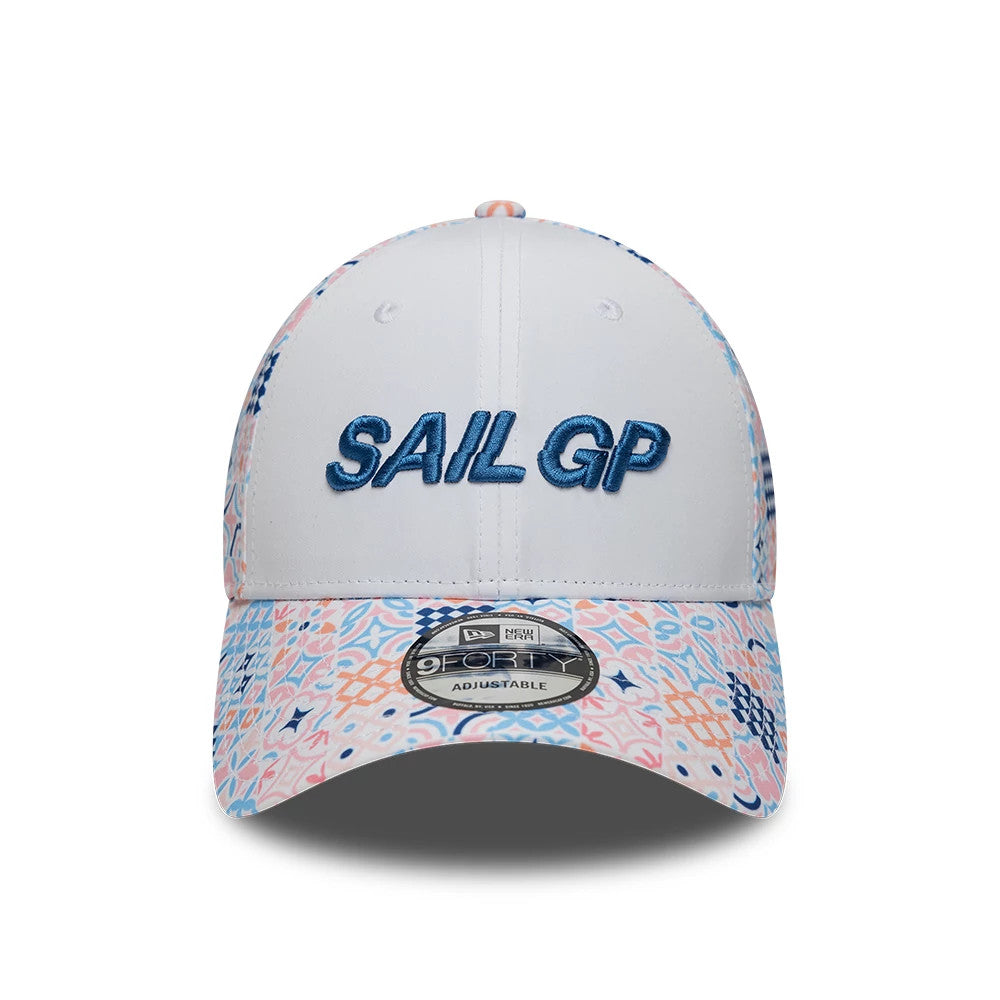 Sail GP Mediterranean Air Event White New Era 9FORTY Adjustable Cap, front view showing the raised blue Sail GP embroidery on the white front panel, multicoloured patterned visor, and silver and black 9FORTY size sticker on the slightly curved visor.