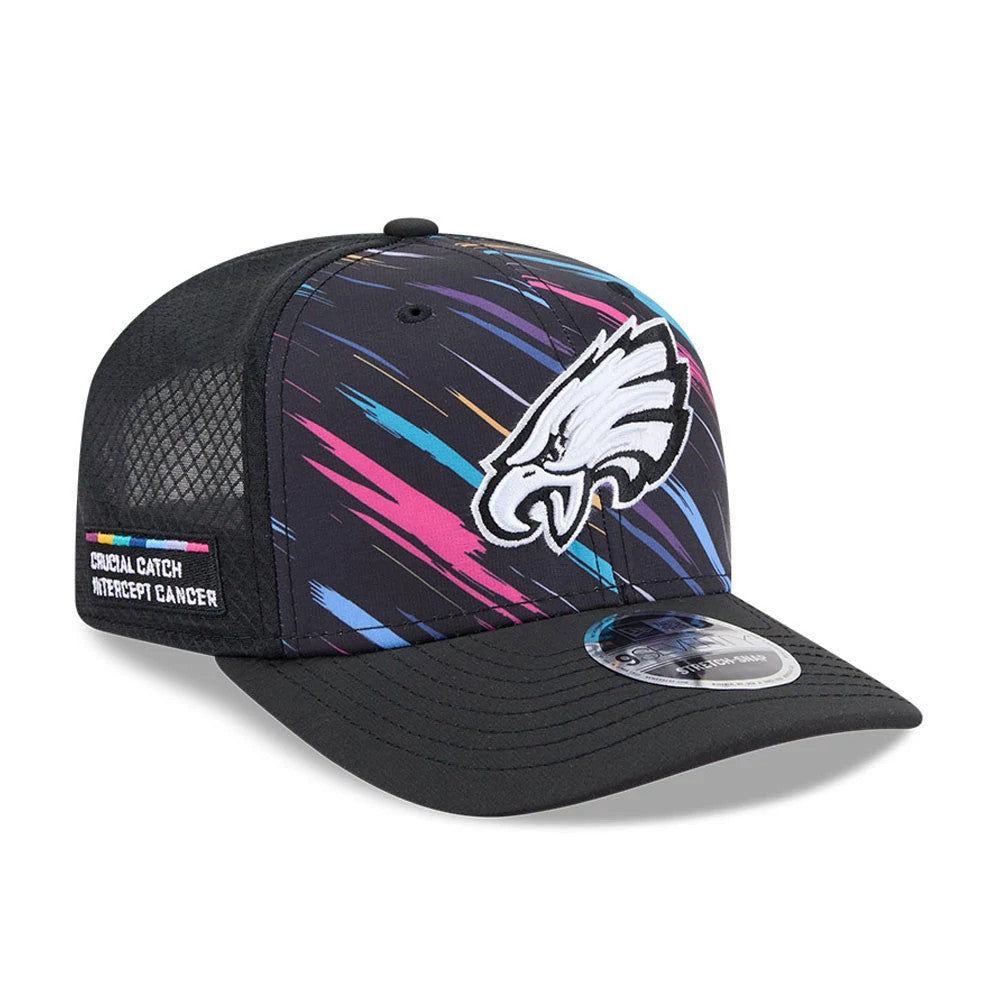 Eagles NFL City Connect 2026 Black New Era 9SEVENTY Stretch Snap Adjustable Cap, three-quarter view showing the white and black embroidered Eagles logo on the front panel, multicoloured streaks, and a 9SEVENTY size sticker on the flat black visor.