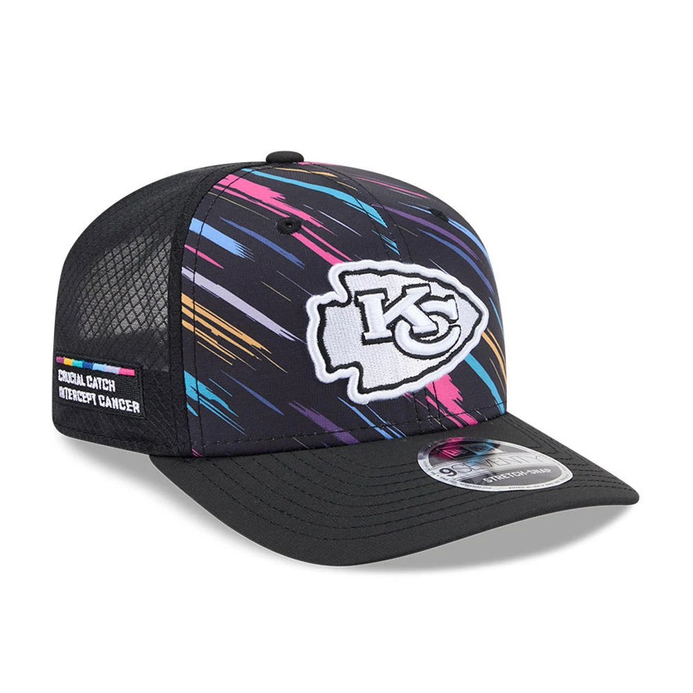 Chiefs NFL City Connect 2026 Black New Era 9SEVENTY Stretch Snap Adjustable Cap, three-quarter view showing a white embroidered Chiefs logo on the multicoloured streaked front panel, Crucial Catch patch on the left side.