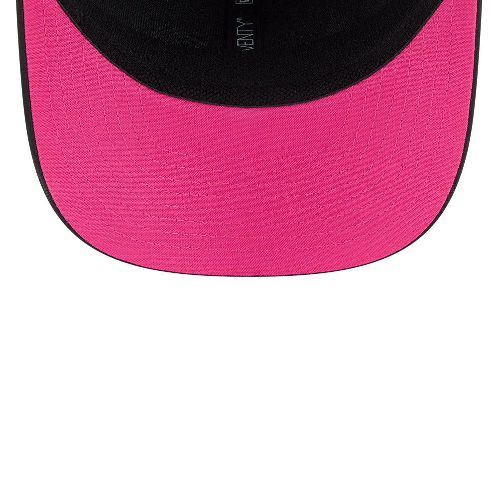 Chiefs NFL City Connect 2026 Black New Era 9SEVENTY Stretch Snap Adjustable Cap, inside view showing the black sweatband with New Era branding, a bright pink undervisor with detailed stitching, and part of the black internal taping.