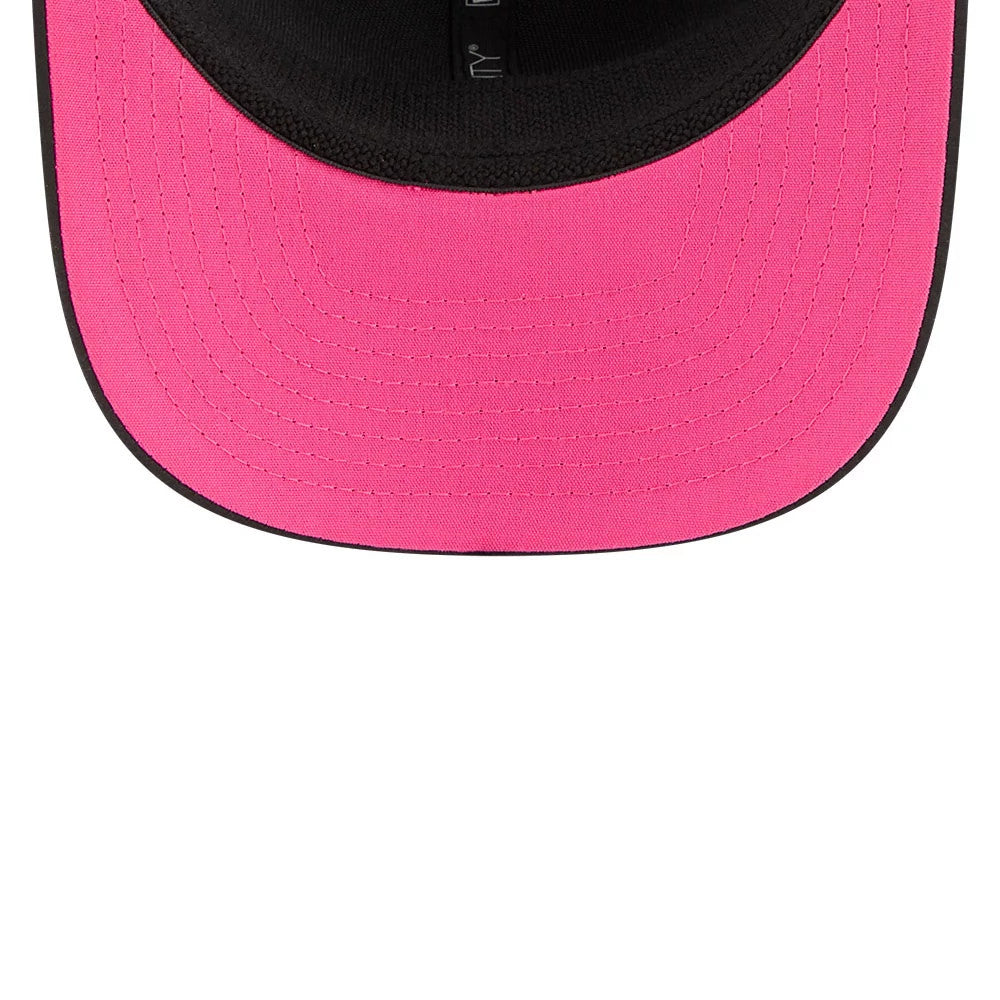 Seahawks NFL City Connect 2026 Black New Era 9SEVENTY Stretch Snap Adjustable Cap, inside view showing pink undervisor, black sweatband, and New Era logo on the taped seams inside the structured crown.
