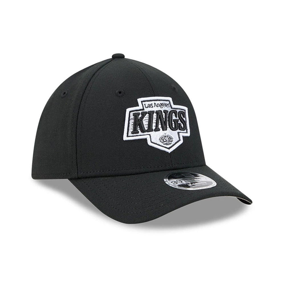 LA Kings NHL Black New Era 39THIRTY M-Crown Stretch Fit Cap, front view showing the embroidered white and black Kings logo on the front panel, a black curved visor with a 39THIRTY size sticker, and matching black eyelets.