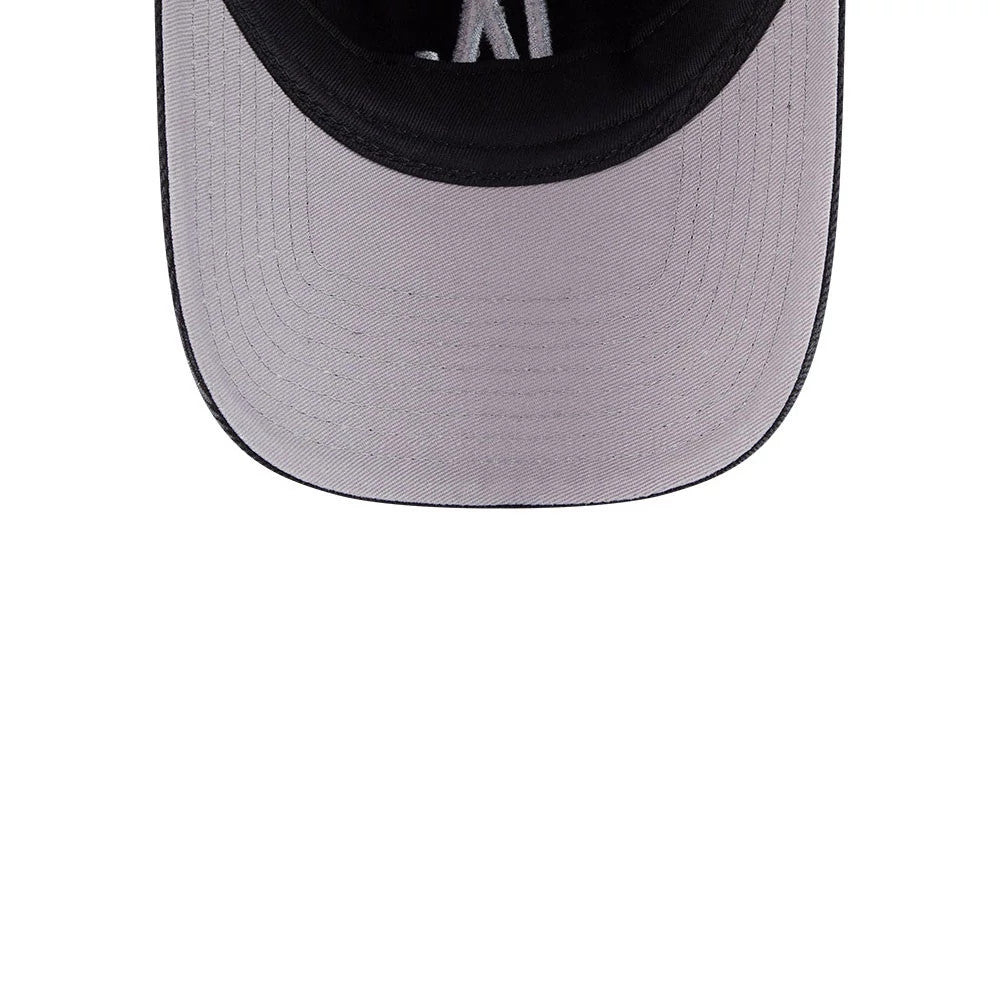 Dodgers MLB Washed Denim Black New Era 9FORTY A-Frame Unstructured Adjustable Cap, inside view showing the grey undervisor with black trim, black interior sweatband and NY lettering on the inner taping.