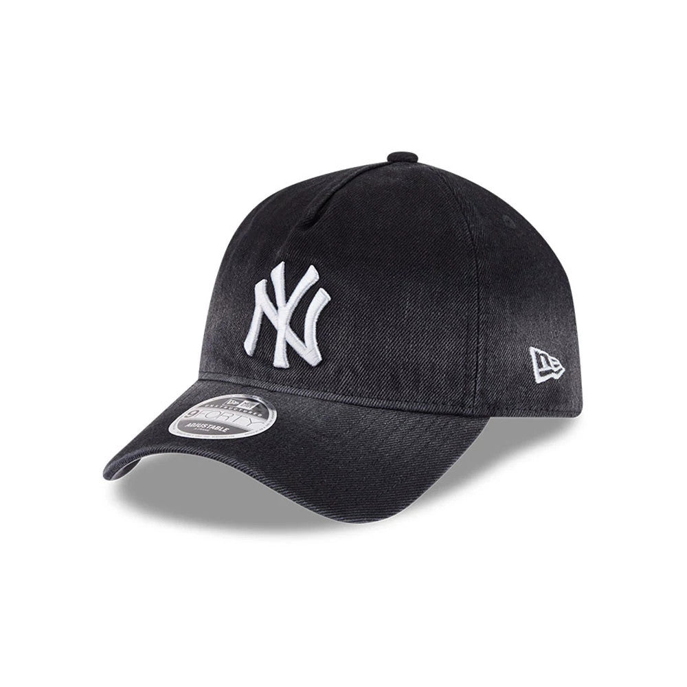 Yankees MLB Washed Denim Black New Era 9FORTY A-Frame Unstructured Adjustable Cap, three-quarter view showing the raised white NY logo on the front panel, black curved visor with a 9FORTY size sticker.