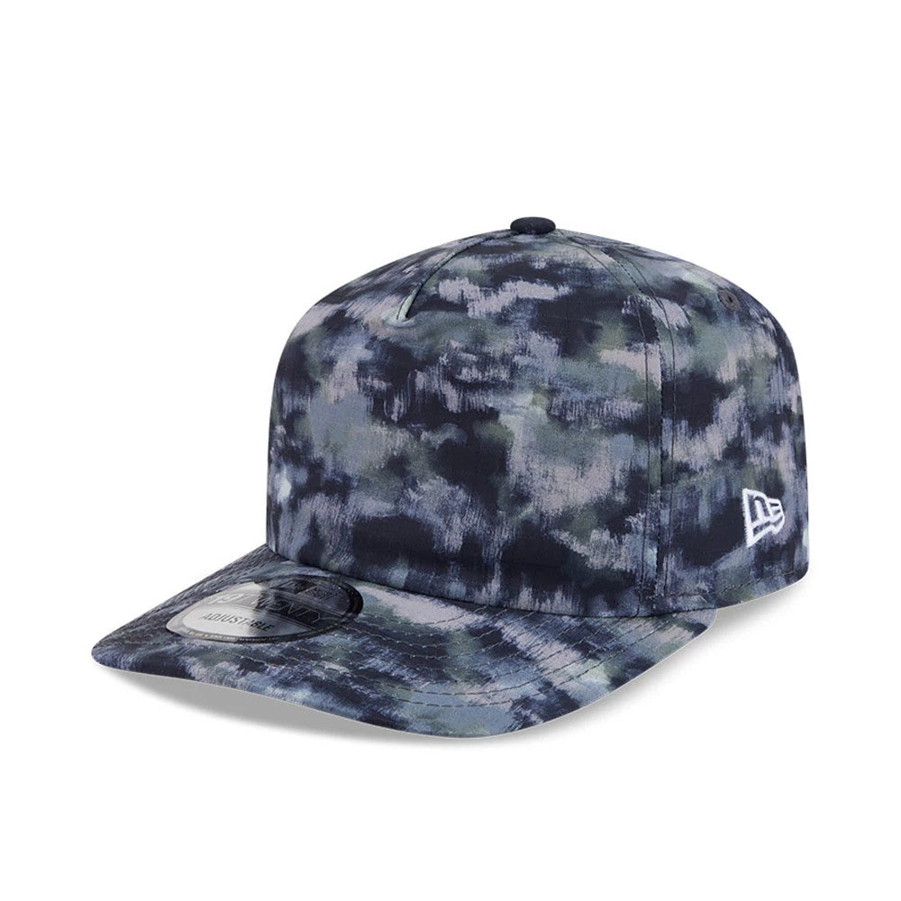 New Era Elevated Basics All Over Print 19TWENTY Adjustable Cap, three-quarter view showing a blue and grey cloud-like pattern across the structured crown and flat visor, with the white embroidered New Era flag logo on the left side.