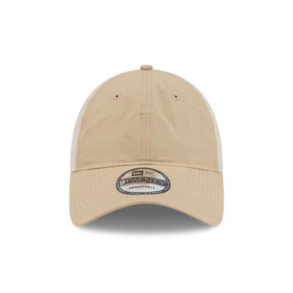 New Era Elevated Basics Open Brown 9TWENTY Adjustable Cap, front view showing a curved beige visor with an attached 9TWENTY size sticker, complemented by matching brown eyelets and a top button on the unstructured crown.