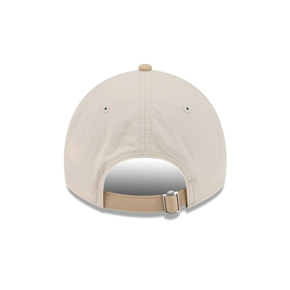 New Era Elevated Basics Open Brown 9TWENTY Adjustable Cap, rear view showing the plain beige back panels with matching eyelets, a tan adjustable strap with a buckle, and a contrast top button completing the minimalist design.