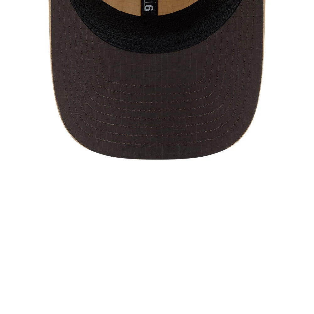 New Era Elevated Basics Open Brown 9TWENTY Adjustable Cap, inside view showing the light brown undervisor with matching stitching details, a black fabric sweatband embossed with 9TWENTY, and contrasting interior taping along the seams.