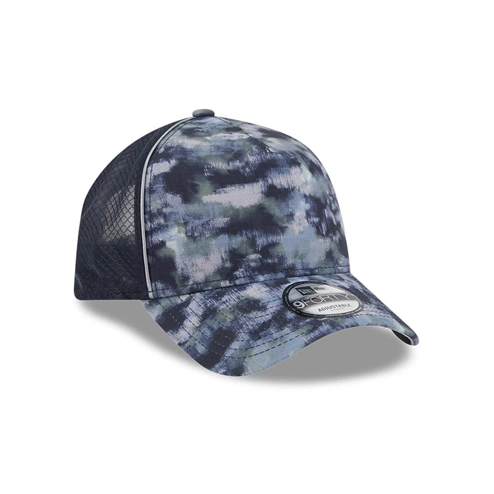 New Era Elevated Basics Navy 9FORTY A-Frame Adjustable Cap, three-quarter view showing a cloud-like navy pattern on the structured front panel and visor, complemented by a navy mesh back and a 9FORTY size sticker on the curved visor.