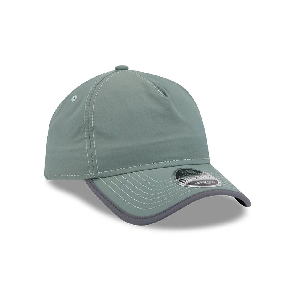New Era Elevated Basics Open Green 9FORTY A-Frame Unstructured Adjustable Cap, three-quarter view showing the unstructured open green crown, grey flat visor with contrasting white stitching, and the 9FORTY size sticker on the visor's top side.
