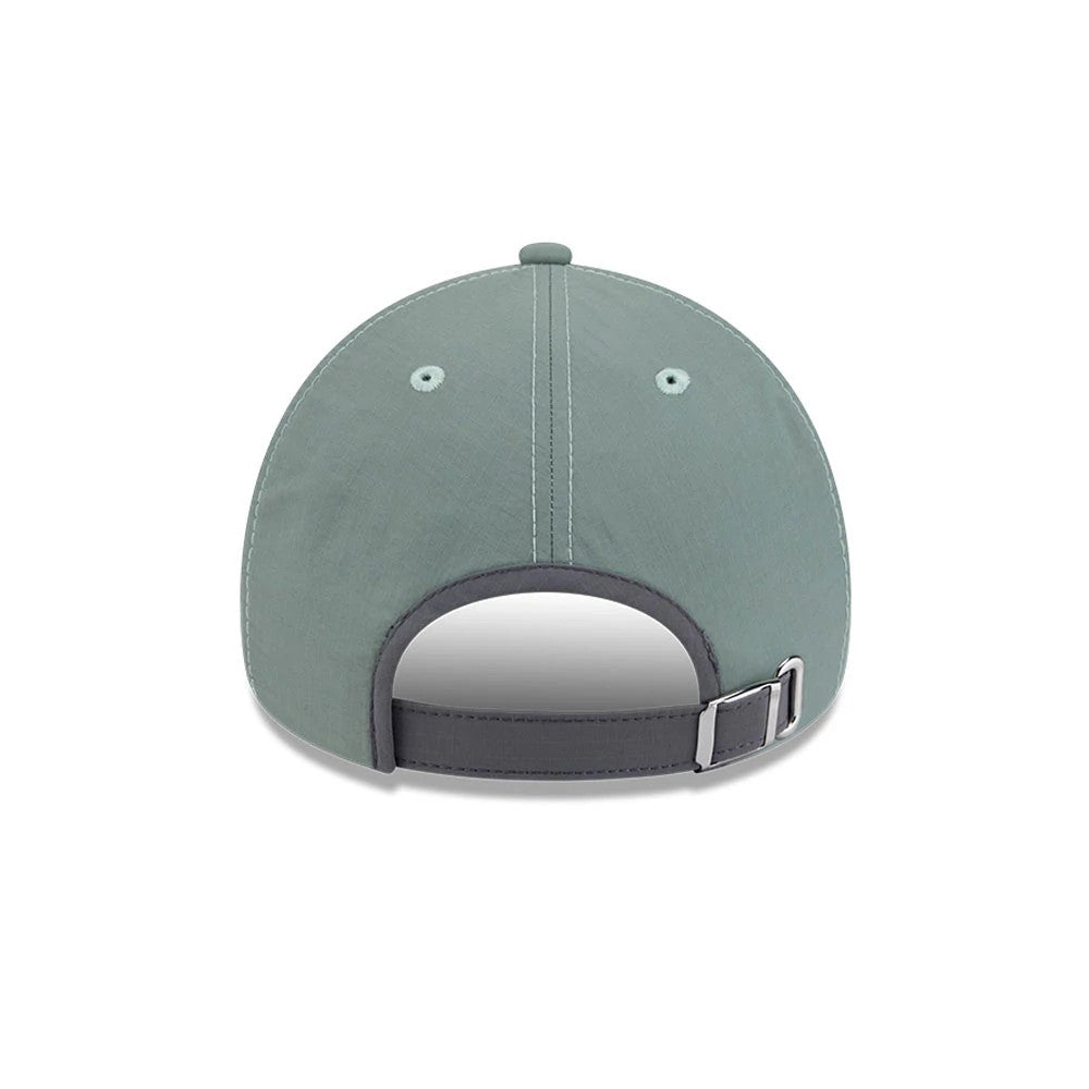 New Era Elevated Basics Open Green 9FORTY A-Frame Unstructured Adjustable Cap, rear view showing a curved grey visor, a adjustable buckle with a fabric strap at the back, and evenly spaced embroidered eyelets on the green crown.