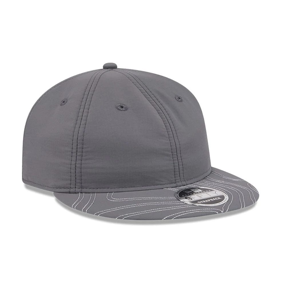 New Era Elevated Basics Open Grey Retro Crown 9FIFTY Adjustable Cap, three-quarter view showing a grey structured crown with matching eyelets and top button, and featuring a grey flat visor with white contour line design.