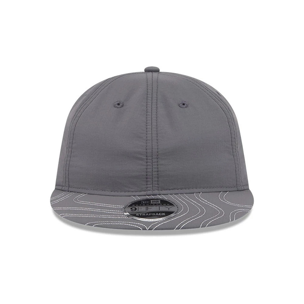 New Era Elevated Basics Open Grey Retro Crown 9FIFTY Adjustable Cap, front view showing a structured grey crown with two embroidered eyelets, a grey visor featuring white topographic line patterns, and a black 9FIFTY size sticker at the centre.