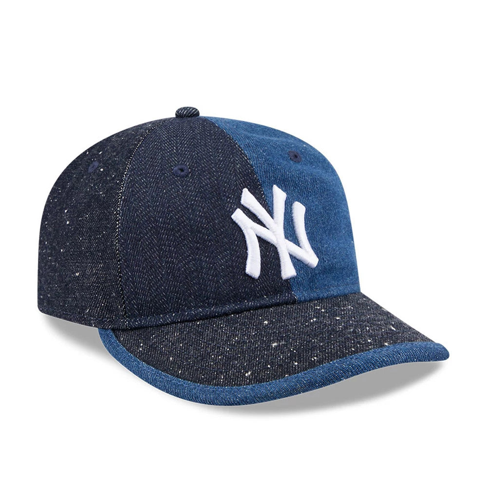 New York Yankees MLB Multipanel Navy Retro Crown New Era 59FIFTY Fitted Cap, three-quarter view featuring a white embroidered NY logo on the front panel, a contrasting navy and blue denim look, and a speckled pattern on the curved visor.