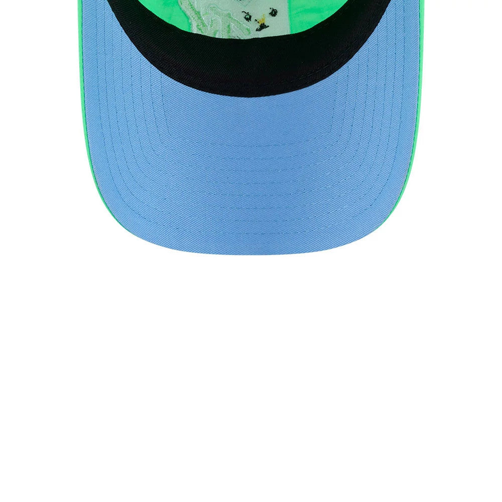 MTV Logo Bright Green New Era 9TWENTY Adjustable Cap, inside view showing the vivid blue undervisor, contrasting black sweatband, and bright green inner lining with a patterned print, highlighting the cap’s unique and eye-catching design elements.